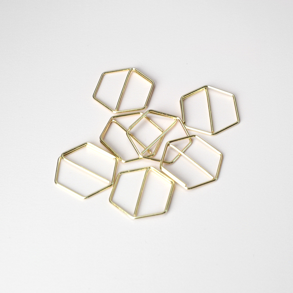 Gouden paperclip hexagon